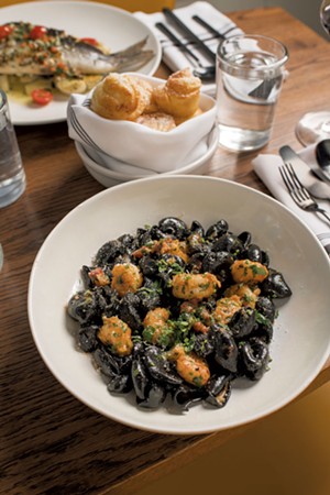 Squid-ink orecchiette with pan-fried rock shrimp, Calabrian salami and chile - CALEB KENNA
