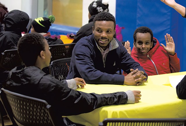 Mohamed Jafar speaking with kids at the King Street Center - LUKE AWTRY