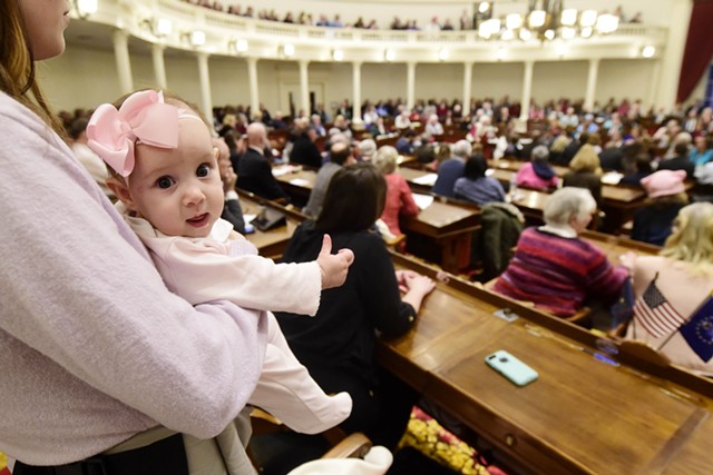 An observer and her baby at the Statehouse Wednesday - JEB WALLACE-BRODEUR