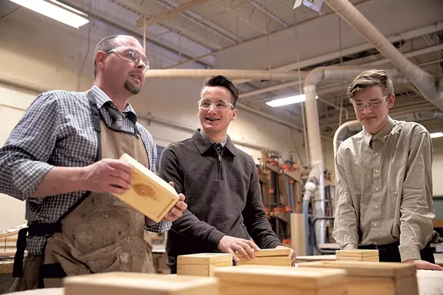 Woodworking teacher and wrestling coach Matthew Stark (left) with Majd Alabas (middle) and classmate - JAMES BUCK