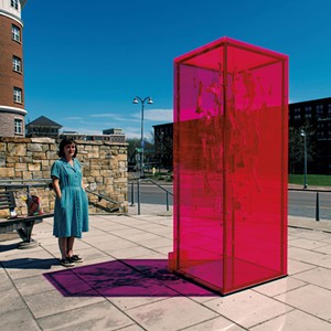 Lydia Kern with her Waking Windows art installation "Perpetual Light" - COURTESY OF DANIEL JAMES CARDON,