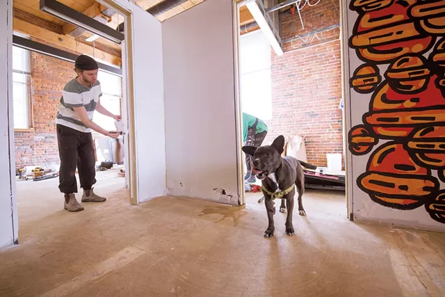 Artist prepping mural for "Time Kills Art" - LUKE AWTRY