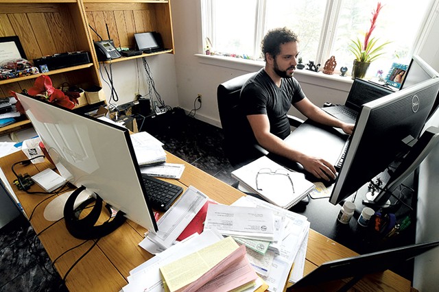 Miguel Turner working remotely from his home office in Cambridge - JEB WALLACE-BRODEUR