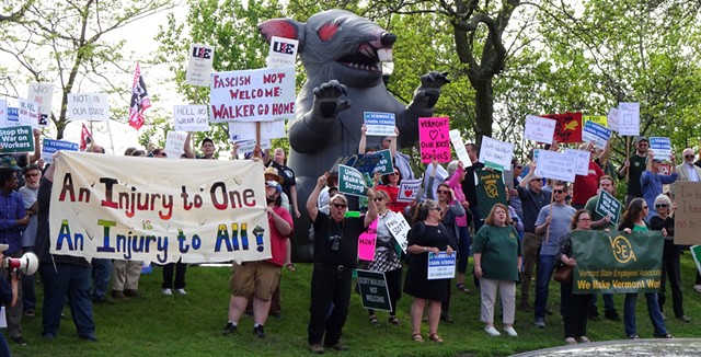 Scabby the Rat, an inflatable prop favored by union protesters, towered over the crowd outside the Hilton. - LEE KROHN
