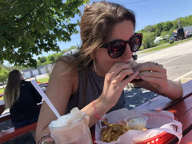 Diggin' into a black bean burger - SABINE POUX