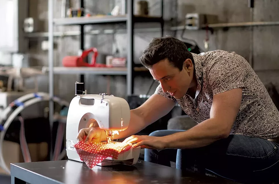 Benedetto sewing a Cuisine Curtain at his Hood Plant headquarters in Burlington - LUKE AWTRY