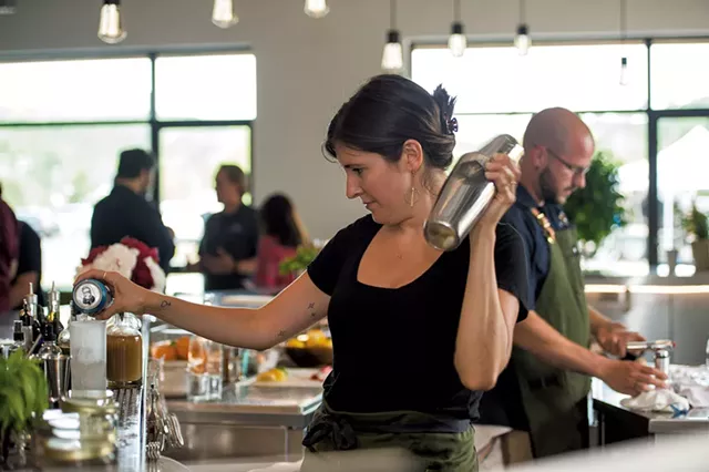 Bartender Emma Sanford and beverage director Sam Nelis preparing cocktails at Caledonia Spirits - DARIA BISHOP