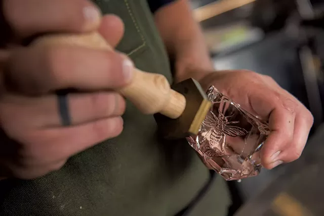 Beverage director Sam Nelis branding ice cubes - DARIA BISHOP