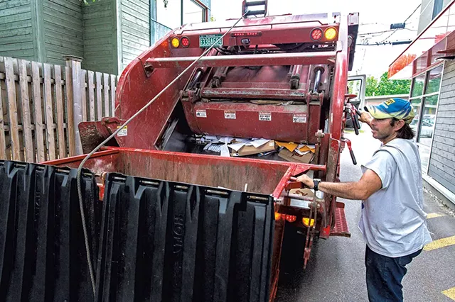 A crew from Myers Container Service loading recyclables in Burlington - GLENN RUSSELL