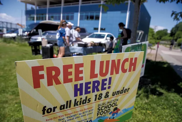 Enjoying a free lunch outside the Community Sailing Center - JAMES BUCK