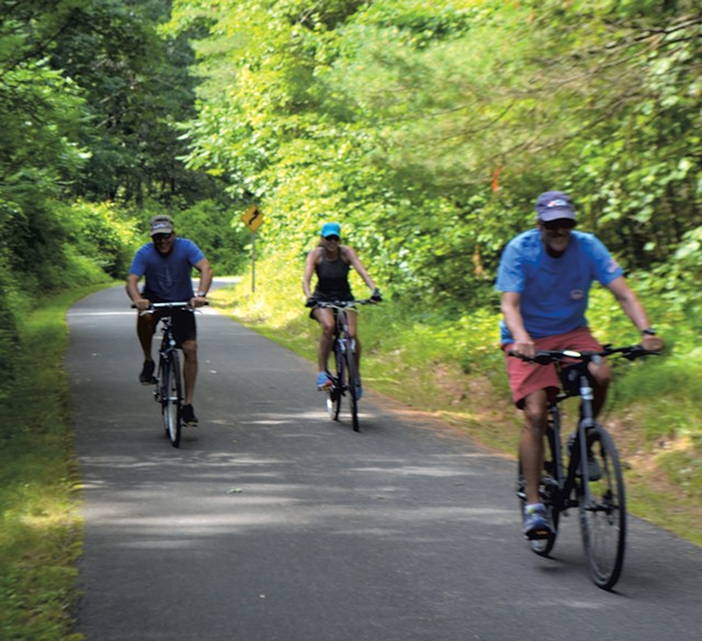 Cyclists on the Warren County Bikeway near Glen Lake