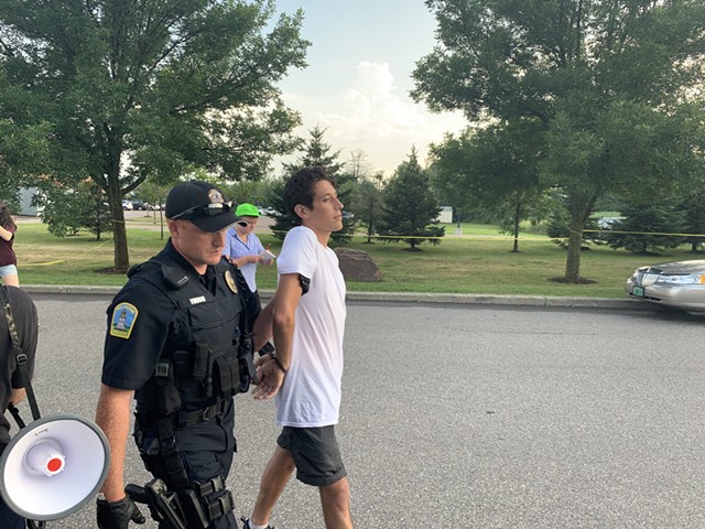 A protester is arrested and cited. - DEREK BROUWER