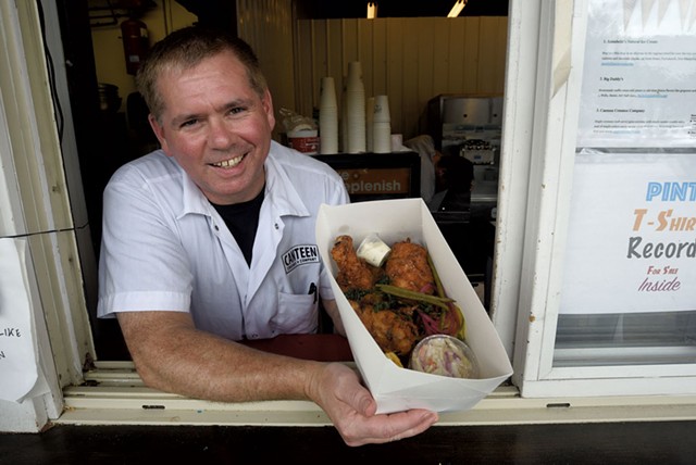 Chef-owner Charlie Menard with a fried chicken box - JEB WALLACE-BRODEUR