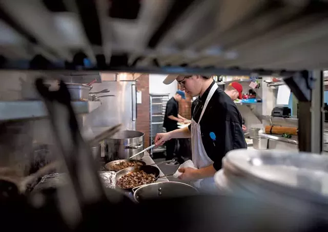 Chef de cuisine Tim Fox sautéing beef at the Inn at Shelburne Farms - GLENN RUSSELL