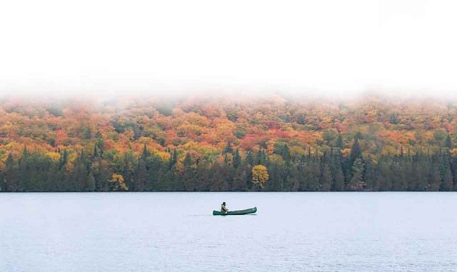 A canoeist out for a morning paddle in the Northeast Kingdom - NATHANAEL ASARO