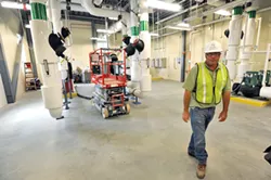 Mike Stevens in the new heating and cooling plant of the new Waterbury complex - JEB WALLACE-BRODEUR