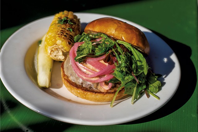 Cheeseburger with side of corn on the cob at Lost Nation Brewing - GLENN RUSSELL