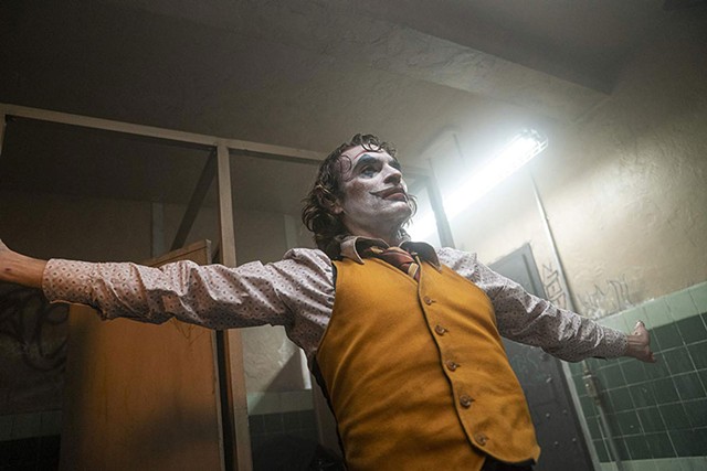 JOKER’S WILD Phoenix plays a would-be funnyman on the verge of mental collapse in Phillips’ sort-of-superhero-adjacent drama.