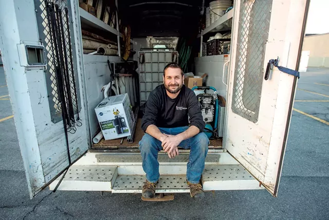 Master plumber Chris Boudreau in the back of his truck - GLENN RUSSELL