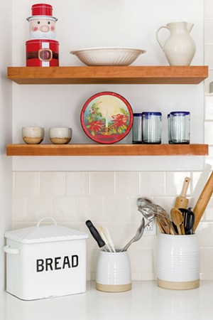 Open shelves create room for storage and holiday displays. - OLIVER PARINI