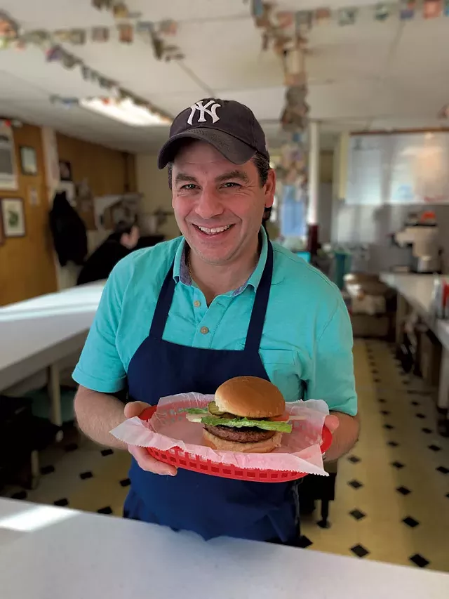 Earl Handy with a plant-based Beyond Burger at Handy's Lunch - MELISSA PASANEN