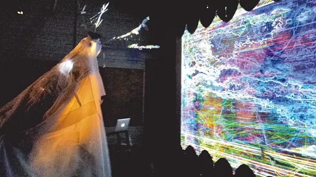 Athena Kafantaris interacting with video during the Simulacrum Project launch - COURTESY OF LEIF HUNNEMAN