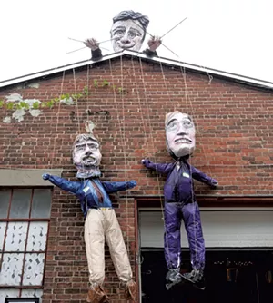 A sculpture of Mayor Miro Weinberger holding puppets of Planning Director David White (left) and Doreen Kraft - COURTESY