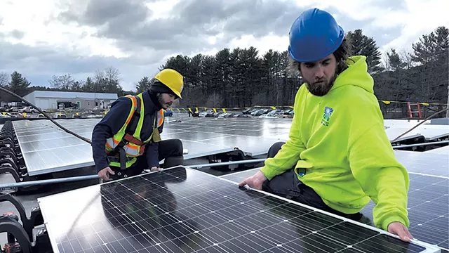Norwich Solar workers installing a new PV system on a business in White River Junction last week - COURTESY OF NORWICH SOLAR