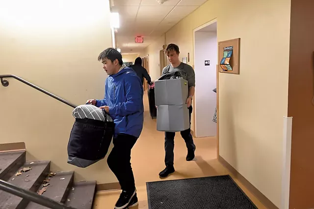 Middlebury College sophomores Aska Matsuda (left) and Sam deWolf moving out of their dorm - JON OLENDER