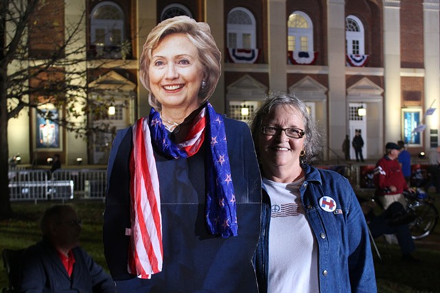 Ellen Friend holds a cardboard cutout of Hillary Clinton outside the Rock Hill forum - PAUL HEINTZ
