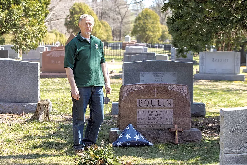 Peter Lavallee at Bob Poulin's grave - LUKE AWTRY