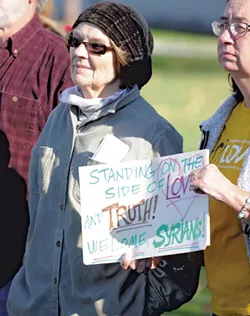 Judy Copa listening to speakers in support of Syrian refugees - JEB WALLACE-BRODEUR