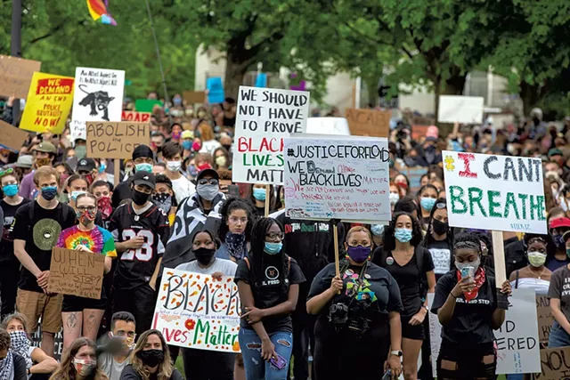 Protesters surrounding the Burlington Police Department - JAMES BUCK