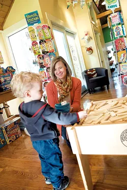 Becky Dayton with a young customer - CALEB KENNA