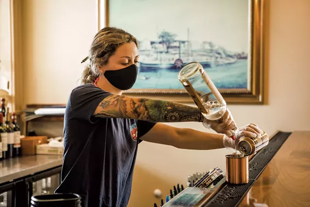 Bartender Morgan McAvoy mixing drinks at Burlington’s Shanty on the Shore in June - LUKE AWTRY
