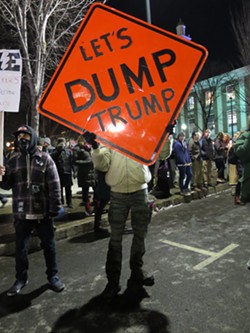 Protesters outside Trump's rally in Burlington Thursday - MATTHEW THORSEN