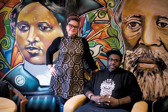 Jennifer Herrera Condry and Will Kasso Condry in front of a mural depicting Mary Annette Anderson and Martin Henry Freeman in 2017 - FILE: CALEB KENNA