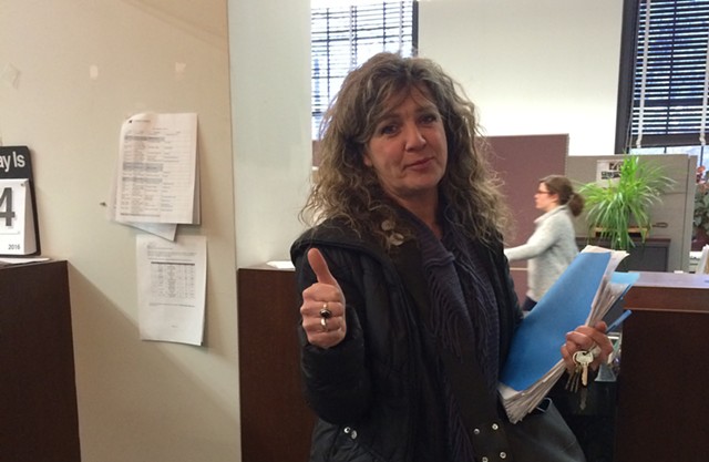 Karen Rowell, a New North End resident, drops off her petition at Burlington City Hall. - ALICIA FREESE
