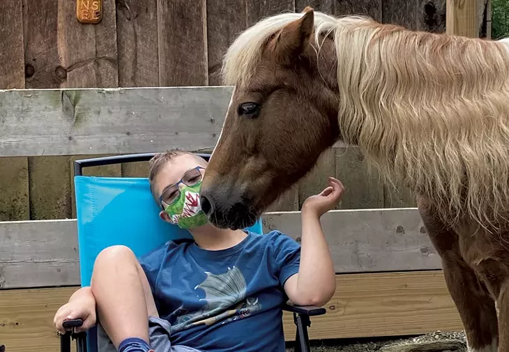 Nate at equine therapy - COURTESY OF CRISTA YAGJIAN