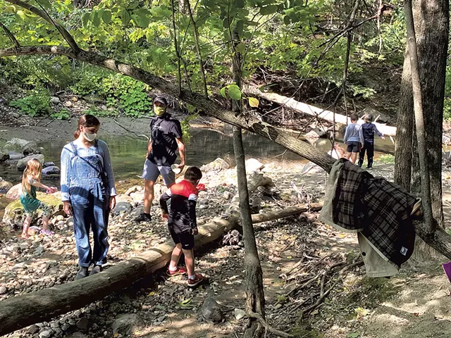 Students playing by Lewis Creek at the Common Ground Center in Starksboro - COURTESY