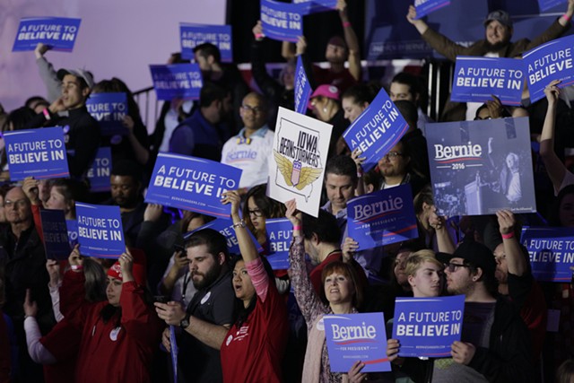 Supporters cheer Sen. Bernie Sanders Monday night in Des Moines. - KRISTIAN DAY