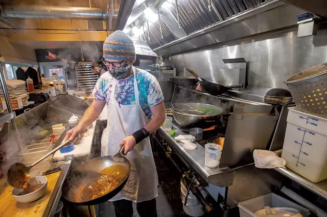 Silas Tanner (front) and Aaron Martin cooking at Umami - JEB WALLACE-BRODEUR
