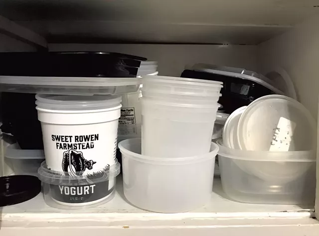 Takeout containers in author's cupboard - SALLY POLLAK ©️ SEVEN DAYS