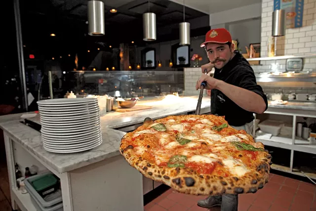 Griffeon Chuba with a fresh pizza - MATTHEW THORSEN
