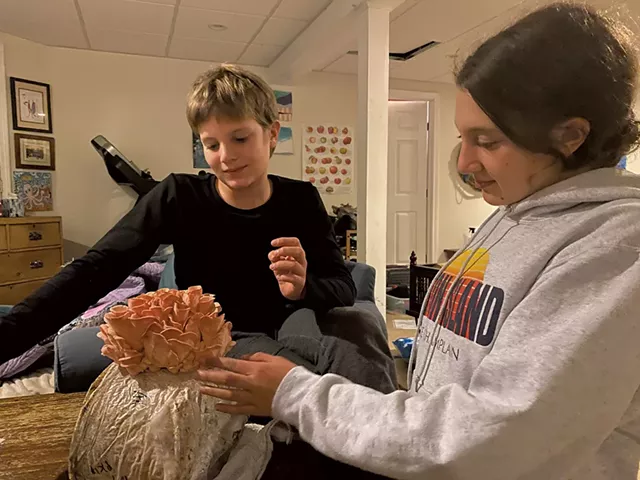 Mira and Theo Novak with a mushroom "log" - ALISON NOVAK