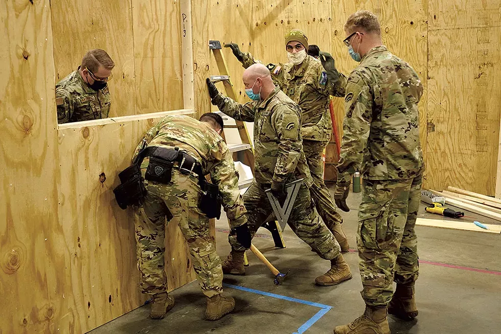 Guard members building a medical facility at the Champlain Valley Exposition in Essex Junction - BEAR CIERI