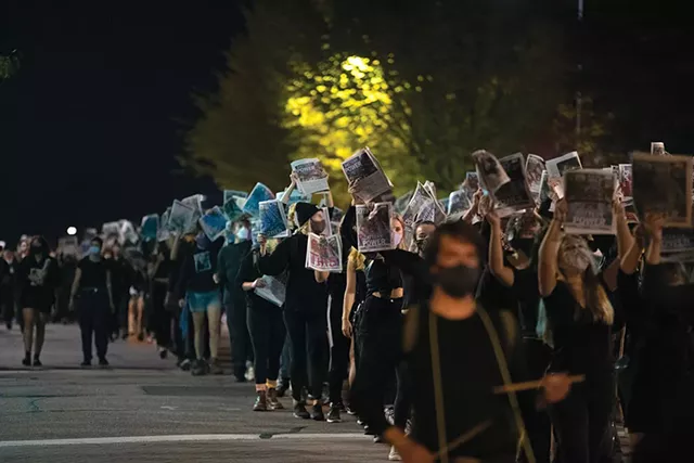 Protesters with copies of Seven Days - FILE: JAMES BUCK