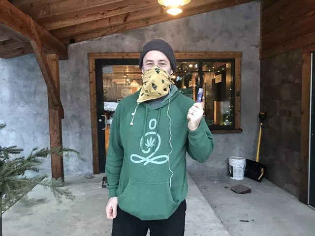 Noah Fishman, holding a hemp joint, for Monday free joint day - SALLY POLLAK ©️ SEVEN DAYS