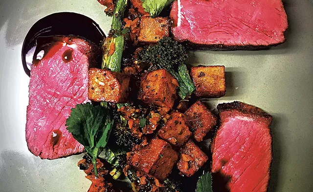 New York strip with potatoes and kimchi at ArtsRiot