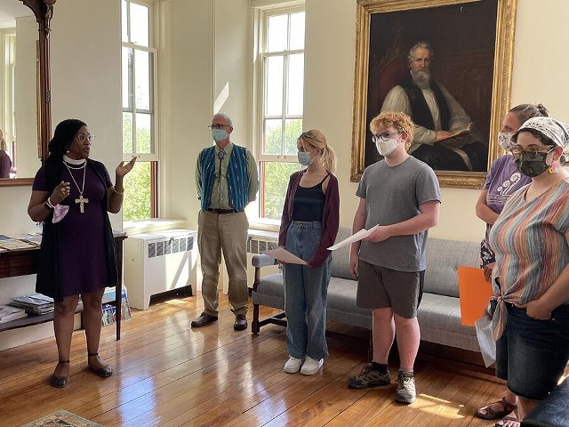 Bishop Shannon MacVean-Brown speaking with students in front of the portrait of John Henry Hopkins that has been removed - COURTESY OF ROCK POINT SCHOOL
